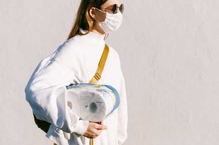 Canva - Sm Woman in Mask Holding Toilet Paper (1)