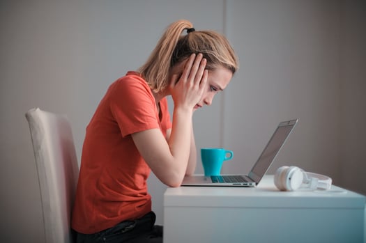 Canva - Sm. Young troubled woman using laptop at home